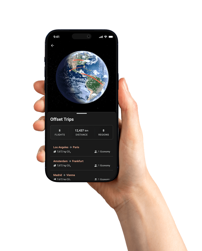 Hand holding a phone with the SkyXero app showing flight offset trips and a globe